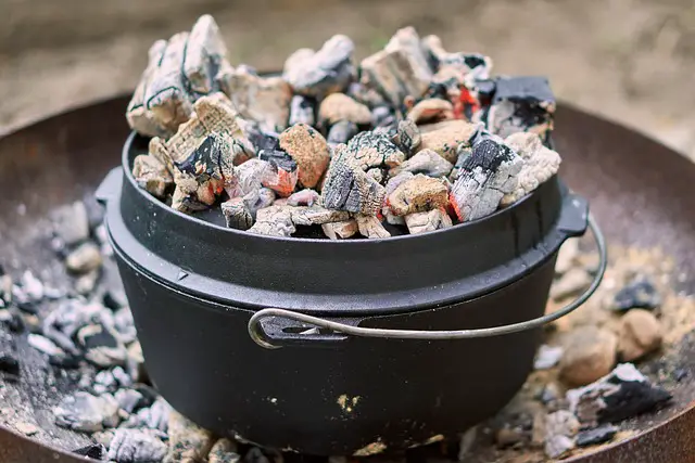 DUTCH OVEN TOPPED WTH COALS