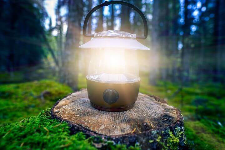 Battery Lantern Shining in the Woods