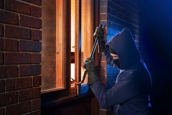 Burglar Breaking Open Window