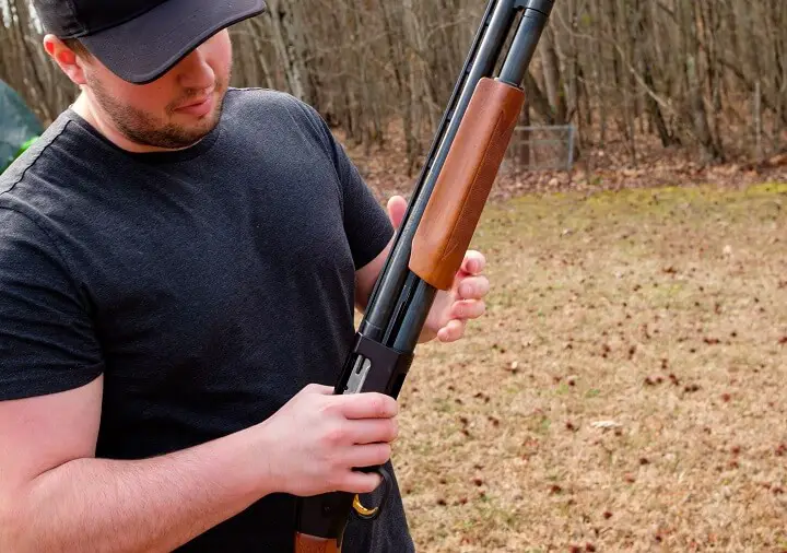 Man Holding 12 Gauge Shotgun