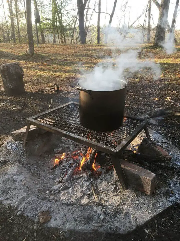 Pot On Grate Over Fire