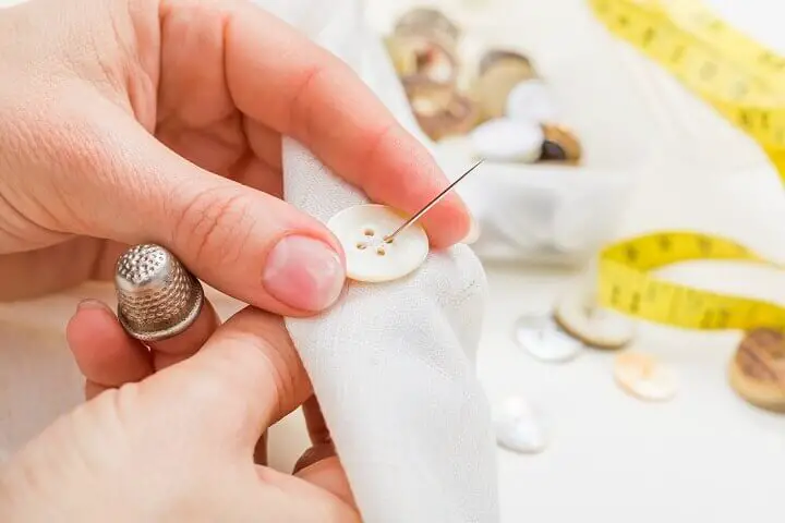 Sewing a Button on a Cloth