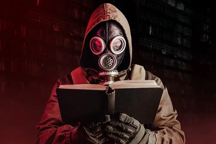 Soldier in Gas Mask Reading Book