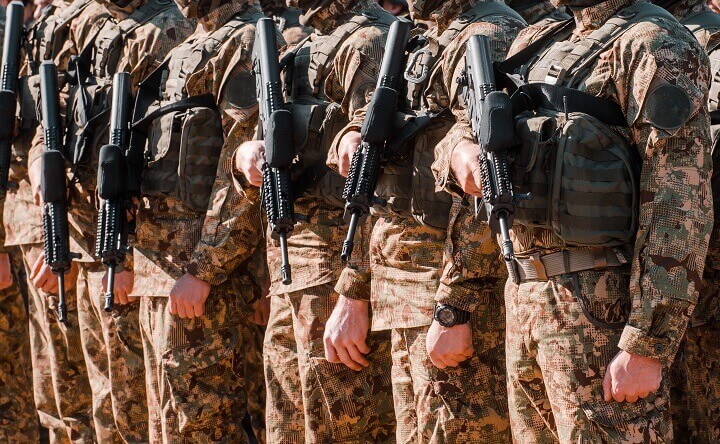 Soldiers Holding Firearms During Martial Law