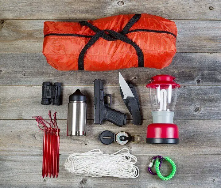 Survival Gear On Wood Table