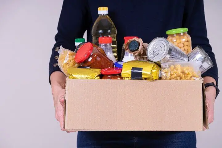 Woman Holding Food Donation Box